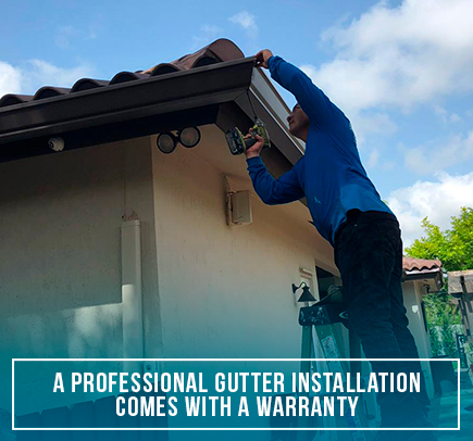 A Professional Installing a Custom Made Seamless Gutter