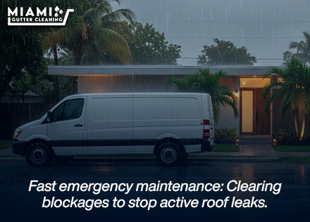 A uniformed technician from our maintenance division using soft-soled footwear and specialized flexible tools to clean gutters beneath curved barrel tile overhangs safely.